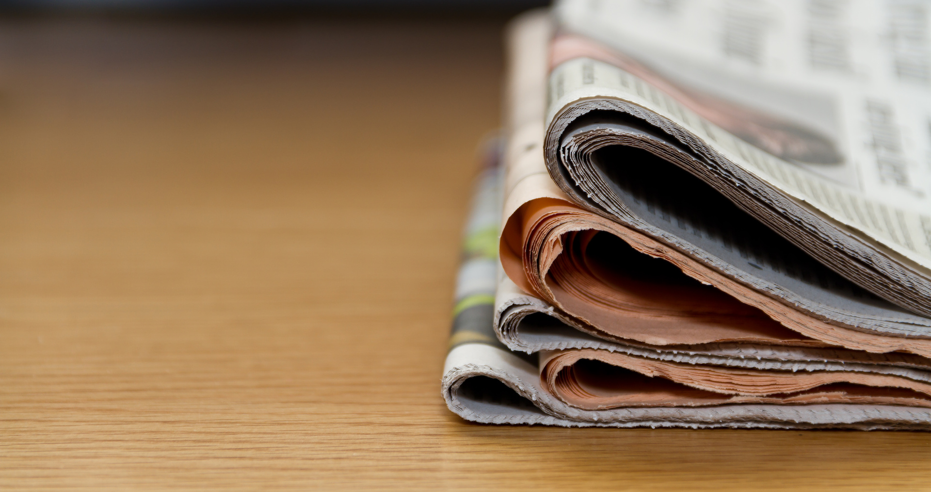 Commercial Internal Communication Imagery Stack of newsletters