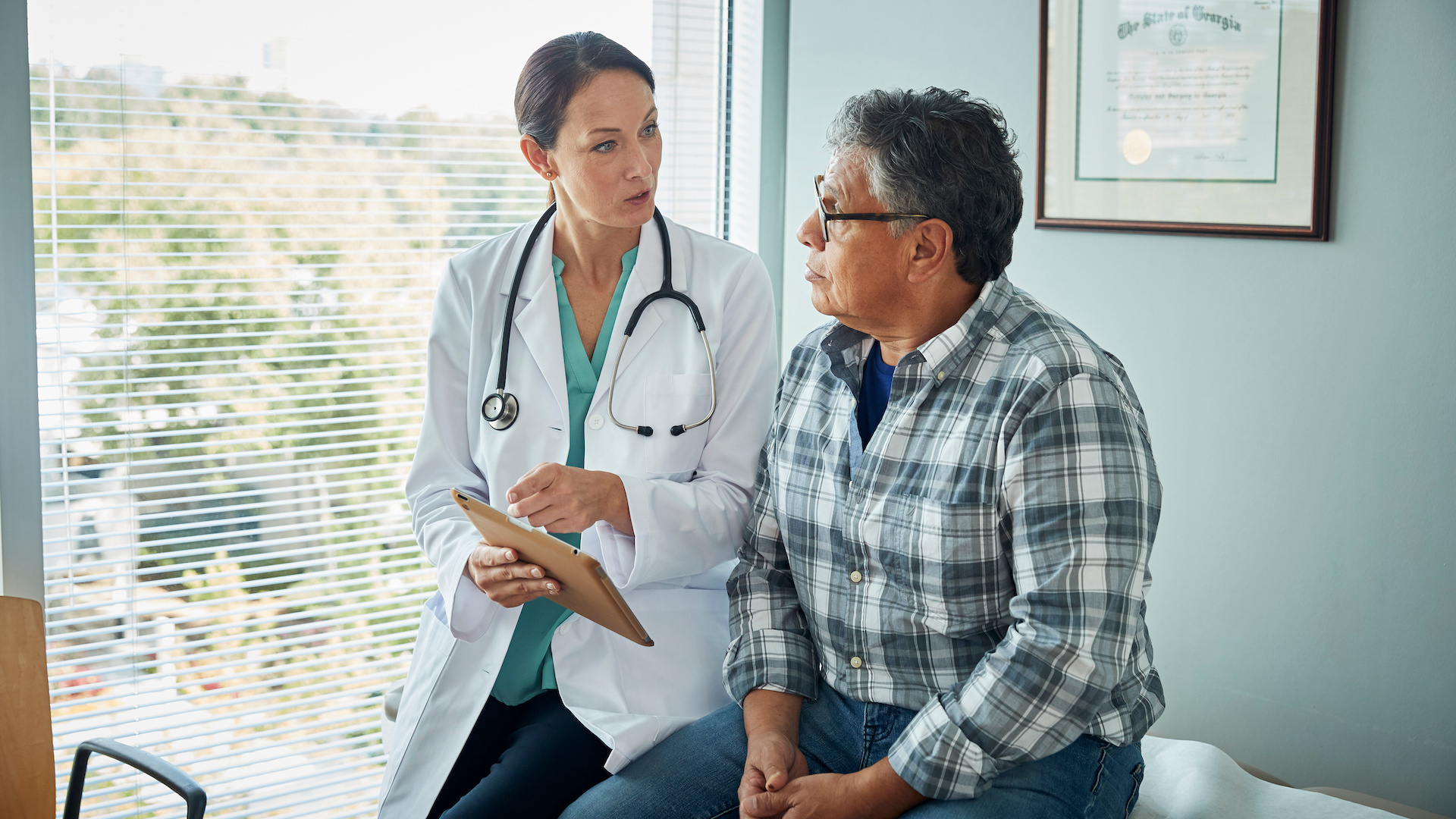 Doctor speaks with male patient